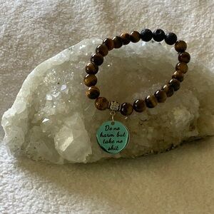 Tiger eye and lava stone beaded bracelet with empowering stainless steel charm